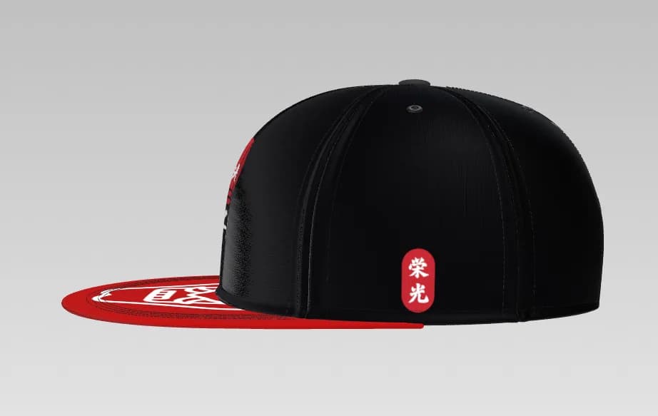 The EIKO samurai snapback from the side, with the 栄光 badge on the panel and a printed red brim